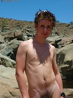 Brad shows off his happy trail on the beach.