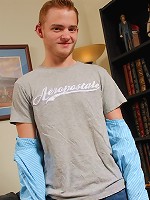 Redhead Aiden Kennedy busts a nut onto his stomach.